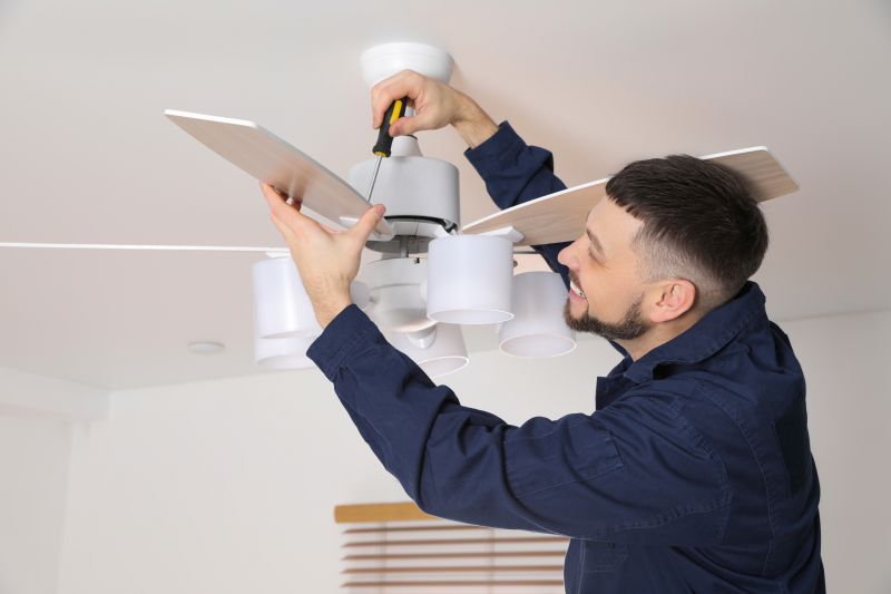 Handyman installing a ceiling fan